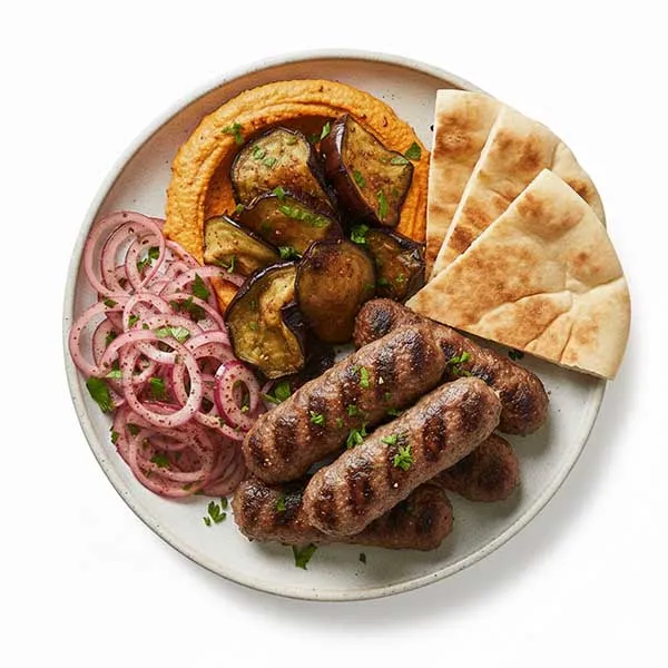 Lebanese beef kofta with spicy harissa hummus, sumac onion  and pita bread
